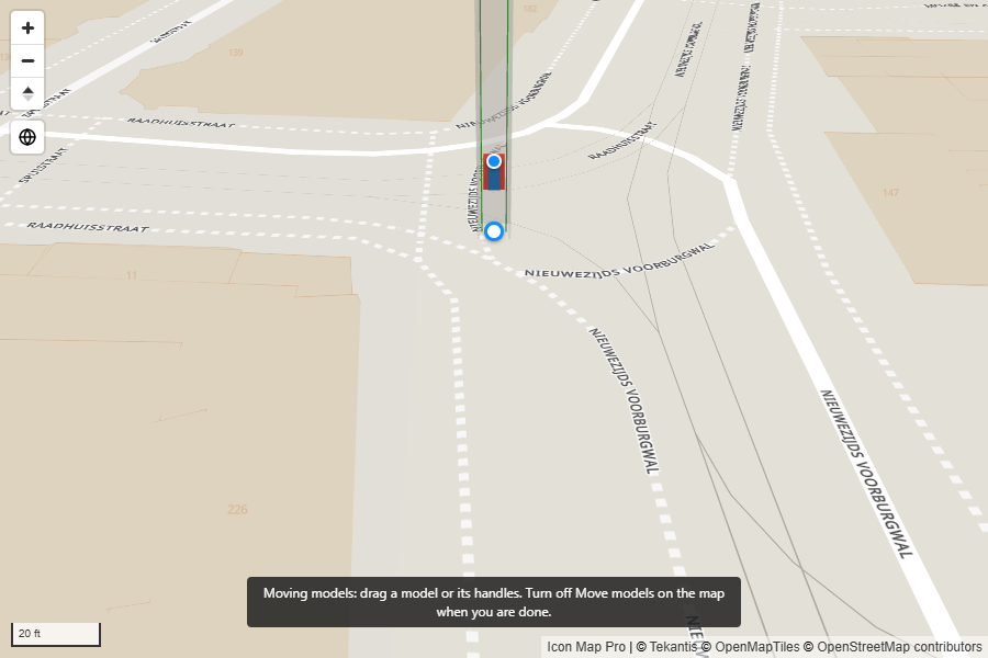 A lift shaft on the map with a white move handle at its base and a blue turn handle, and the note: Moving models: drag a model or its handles