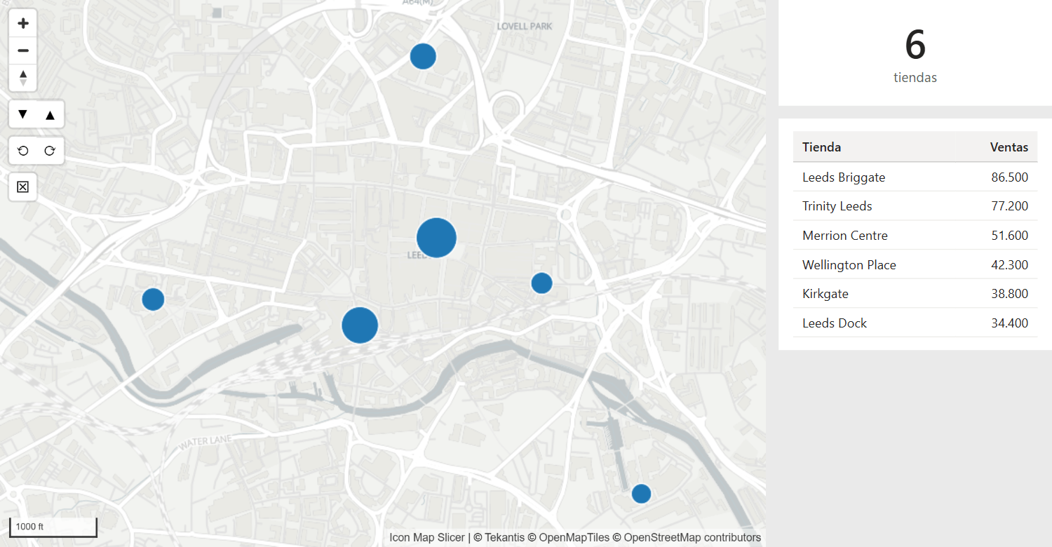 El mapa acercado a una ciudad, junto a una tabla y una tarjeta que muestran solo las tiendas que hay dentro de la vista del mapa
