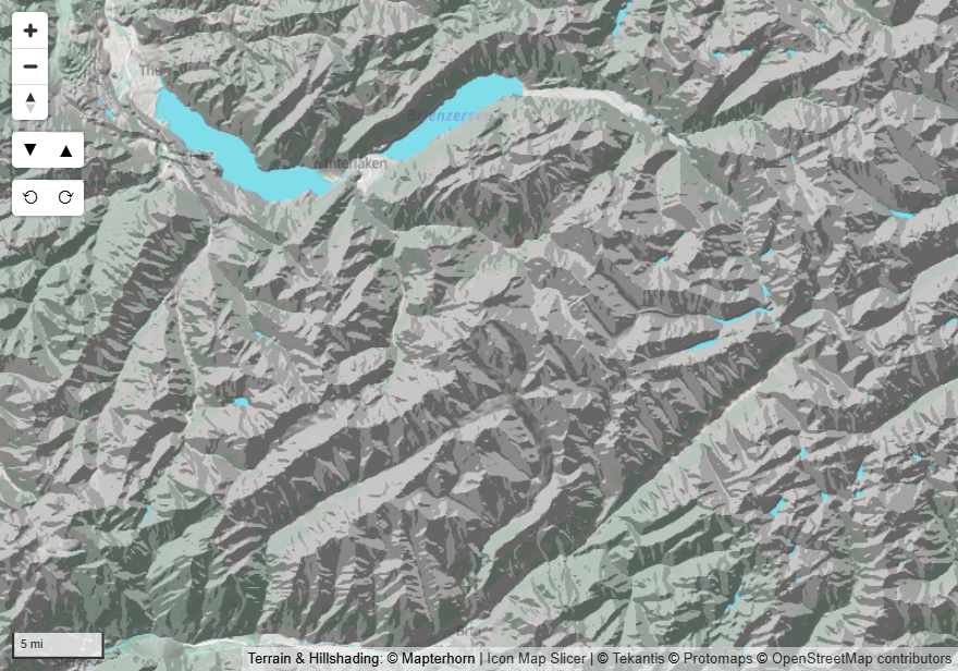 A mountain area with hillshade over a light basemap, viewed from straight above