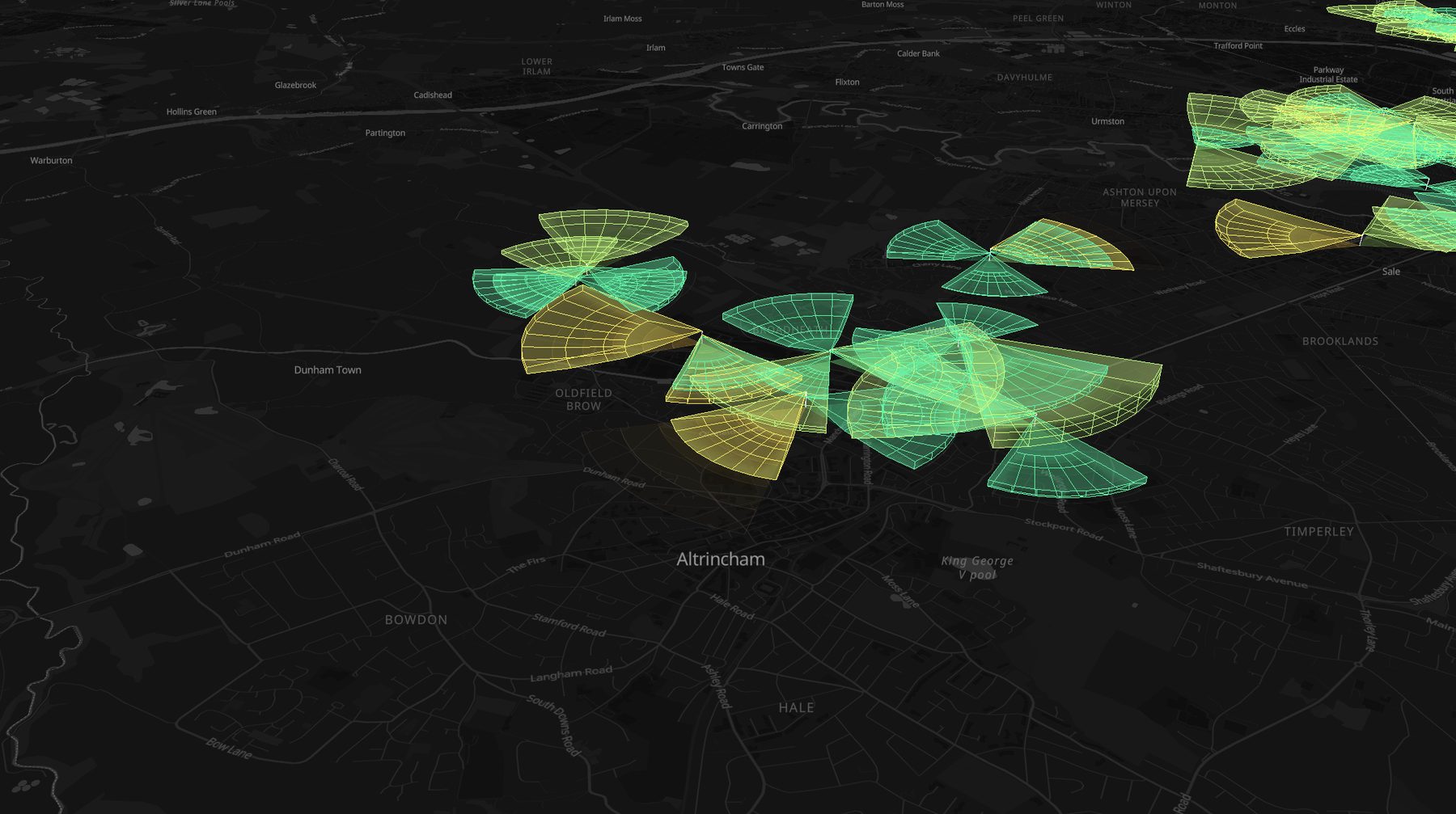 Tilted 3D view of blueprint-style wireframe coverage volumes over Altrincham, colored by KPI health